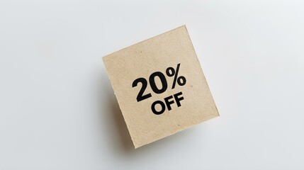 Black '20% OFF' Text on a Light Brown Square Paper Note. White Background with Copy Space