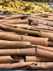  vibrant assortment of colorful Indian spices in small bowls arranged on a wooden surface. This photo captures the rich textures and earthy tones of traditional spices, perfect for culinary and cultur