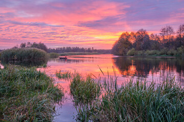 Purple dawn behind the river.