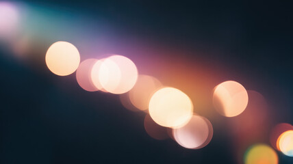 Abstract blurred lights create a colorful bokeh effect, featuring soft pastel hues blending together in a dreamy aesthetic.