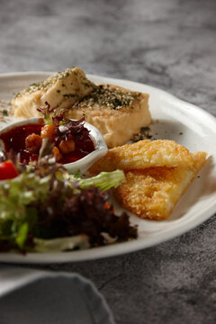 Eggs and hashbrowns with salad