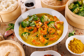 grilled shrimp with coconut cream and curry, rice and vegetables