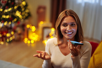 Young brunette woman talking on the phone and smiling