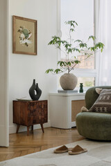 Chic corner decor featuring wooden furniture, greenery, and a blend of natural textures for a cozy...