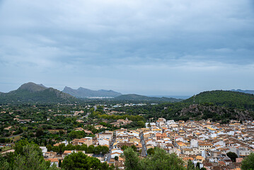 Fototapeta premium Landscape photography of mountains and resort town Pollenca after rain, holiday destination, houses, tourism, vacation, Spain, Mallorca