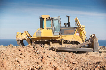 rubble dump site, dozer photo