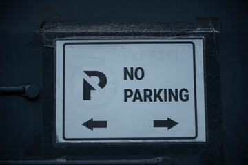 no parking sign on a wall