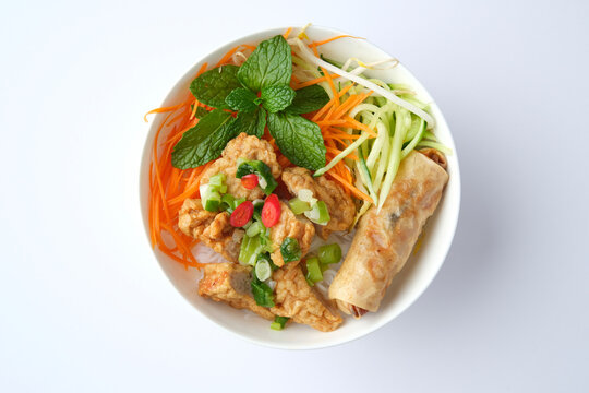 Bun Cha Gio bowl topped with fried spring roll and Cha Lua.