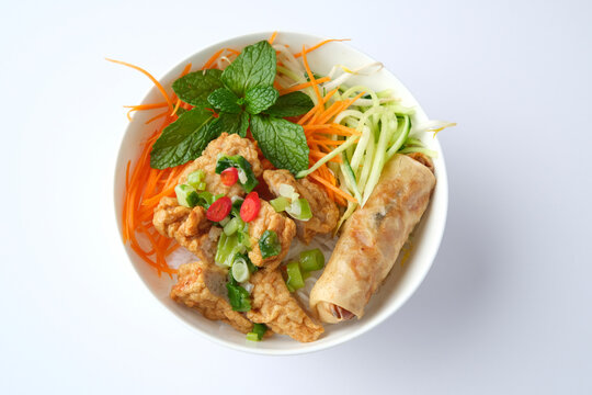 Bun Cha Gio bowl topped with fried spring roll and Cha Lua.