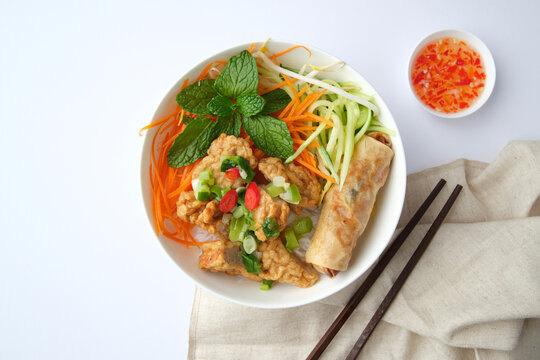 Bun Cha Gio bowl topped with fried spring roll and Cha Lua.