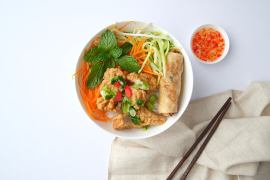 Bun Cha Gio bowl topped with fried spring roll and Cha Lua.