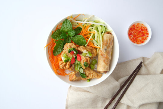 Bun Cha Gio bowl topped with fried spring roll and Cha Lua.