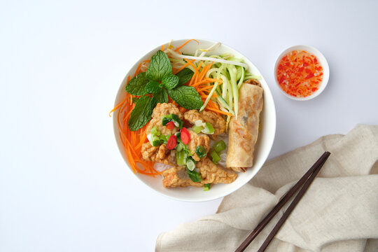 Bun Cha Gio bowl topped with fried spring roll and Cha Lua.