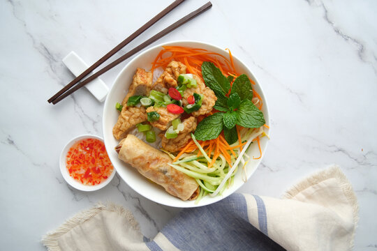 Bun Cha Gio bowl topped with fried spring roll and Cha Lua.