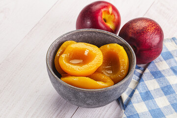 Canned peaches with sweet syrope