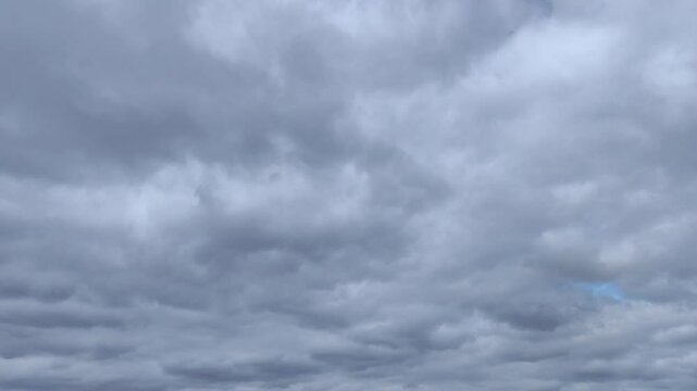 Strange gray stratocumulus clouds moving