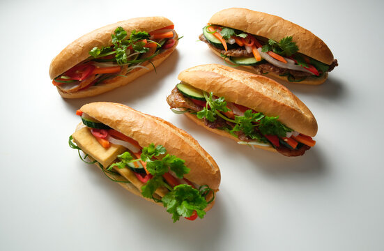 Four banh mi on blank background