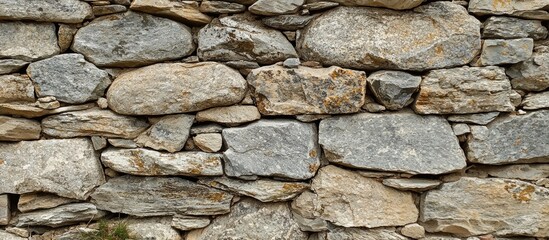 Obraz premium A Closeup Shot Of A Stone Wall Good For Background
