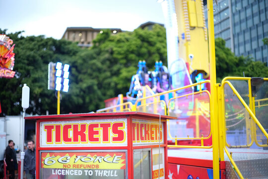 Close-up shot of a ticket booth at the carnival during daytime