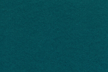 Texture of craft emerald and teal paper background colors, macro. Structure of vintage kraft jade cardboard.