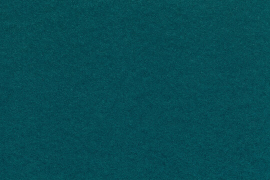 Texture of craft emerald and teal paper background colors, macro. Structure of vintage kraft jade cardboard.