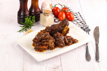 Prepared tasty beef ribs with sauce
