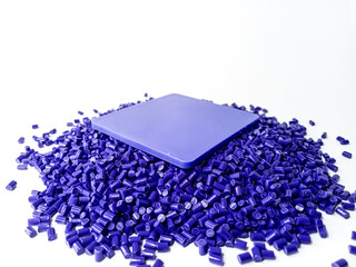 Violet polymer masterbatch granules isolated on white background for plastic product profile...