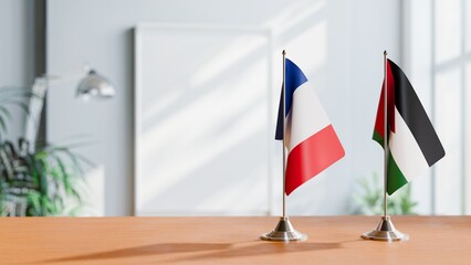 FLAGS OF FRANCE AND JORDAN ON TABLE