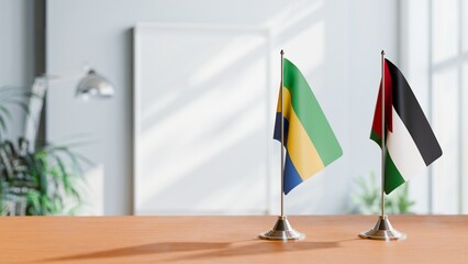 FLAGS OF GABON AND JORDAN ON TABLE