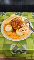 Rice cake with chicken curry or lontong opor in Bahasa