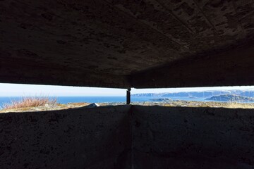 View from inside of old WW2 German bunkers at Veidnes in clear blue sky weather in summer,...