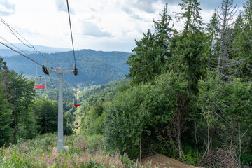 Mountains ranges in the Carpathians cableway. Hills, forest and meadows. Green valley Ukraine