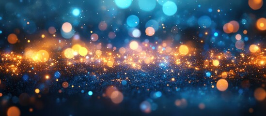 Obraz premium Abstract blue and gold bokeh background with glittering particles.