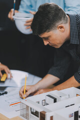 Obraz premium Team Engineers with draft plan of building on constructing site. Engineer work on site. engineer visit and inspection site engineer. Inspector engineer check and working on site.