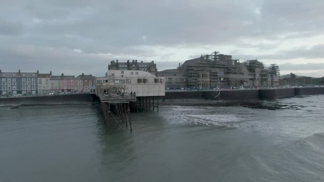 Aberystwyth Seafront pier and Shoreline Wales Aerial low close up