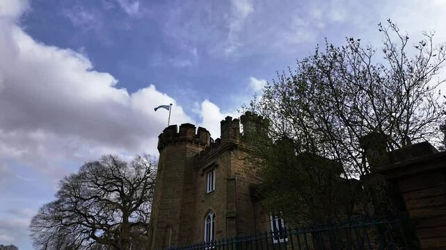 Timelapse of cloudscape above traditional English cottage,Tudor Lodge, Edensor