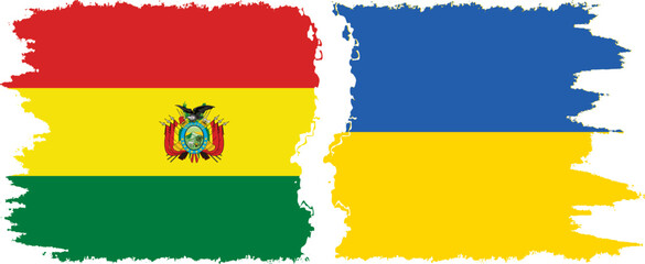 Obraz premium Ukraine and Bolivia grunge flags connection, vector