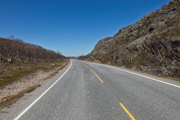 View of Ravttebelgeainu E6 road in sunny summer weather, Norway.