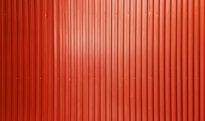 real chrome light red corrugated metal sheet wall showing vertical pattern, bolts, screw. modern...