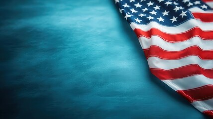 Obraz premium A close-up view of an American flag draping over a textured surface, symbolizing patriotism and national pride.