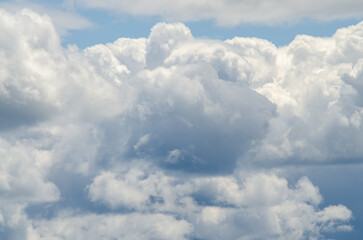 Many large clouds against the sky