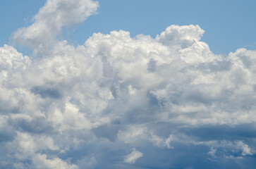 Many large clouds against the sky