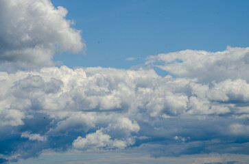 Many large clouds against the sky