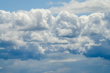 Many large clouds against the sky