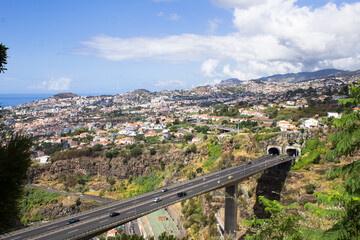 View of the city, ocean and bridge on a summer day. Funchal. Madeira. Portugal.