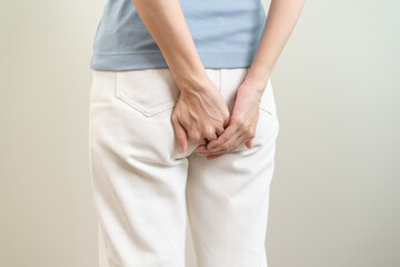 Health care, pain asian young woman suffering from hemorrhoid, anus, diarrhea and constipation,...