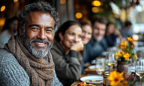 A joyful gathering of friends enjoying a meal together.