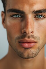 Obraz premium A man with a beard and blue eyes. The man has a very clean and well-groomed appearance
