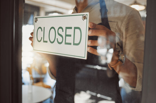 Closed, sign and waiter by door of cafe for announcement, information and notice of service time. Entrance, board and small business owner for public communication, message and update at restaurant