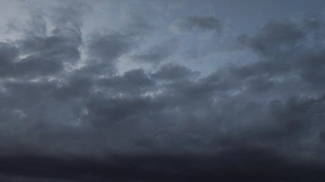 Black stratocumulus cloud covers everything at dusk